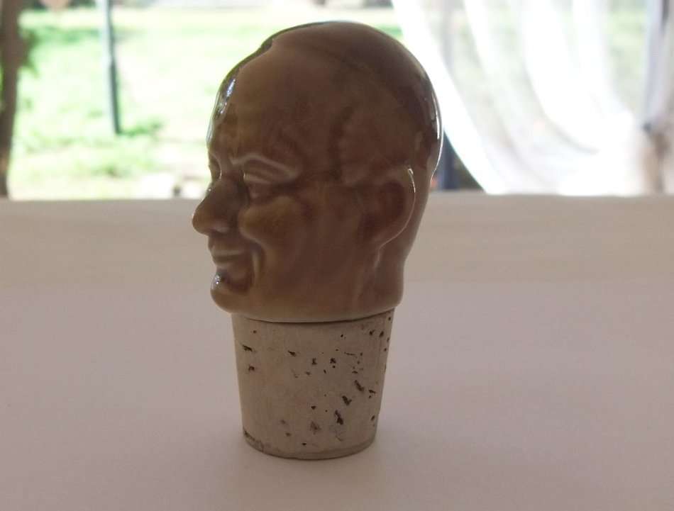 A VINTAGE MONK MOTIF BOTTLE CORK STOPPER