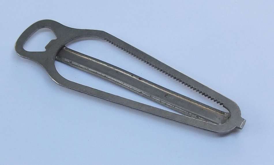 A VINTAGE BOTTLE OPENER / LID REMOVER MADE IN ENGLAND