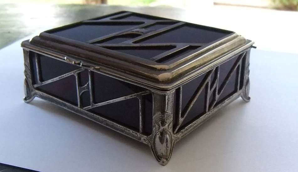 A BEAUTIFUL ART DECO PERIOD METAL AND GLASS JEWELRY BOX
