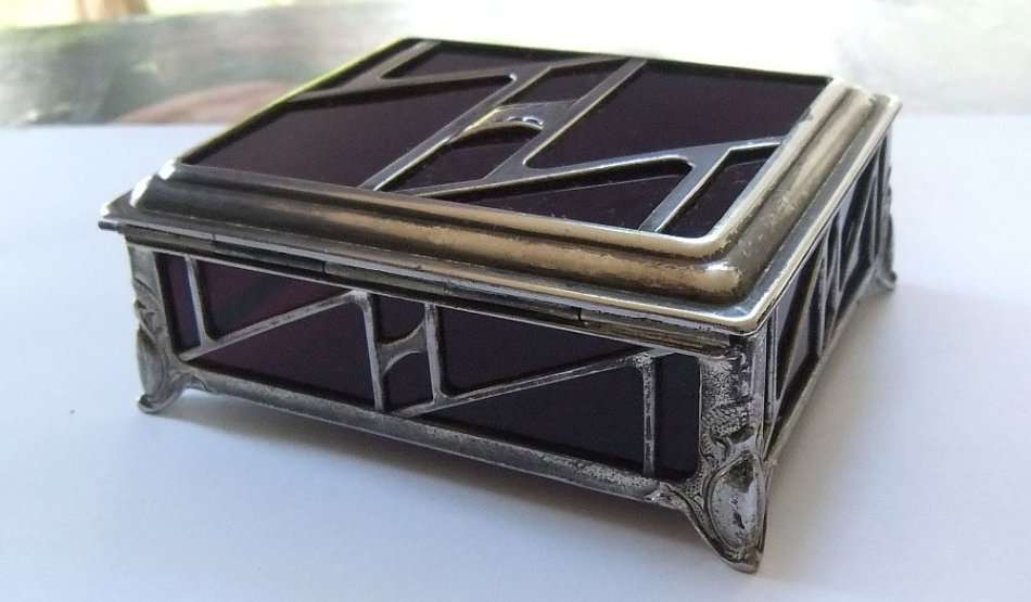 A BEAUTIFUL ART DECO PERIOD METAL AND GLASS JEWELRY BOX