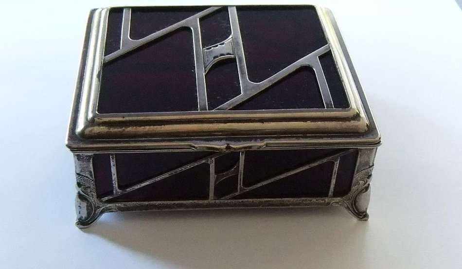 A BEAUTIFUL ART DECO PERIOD METAL AND GLASS JEWELRY BOX