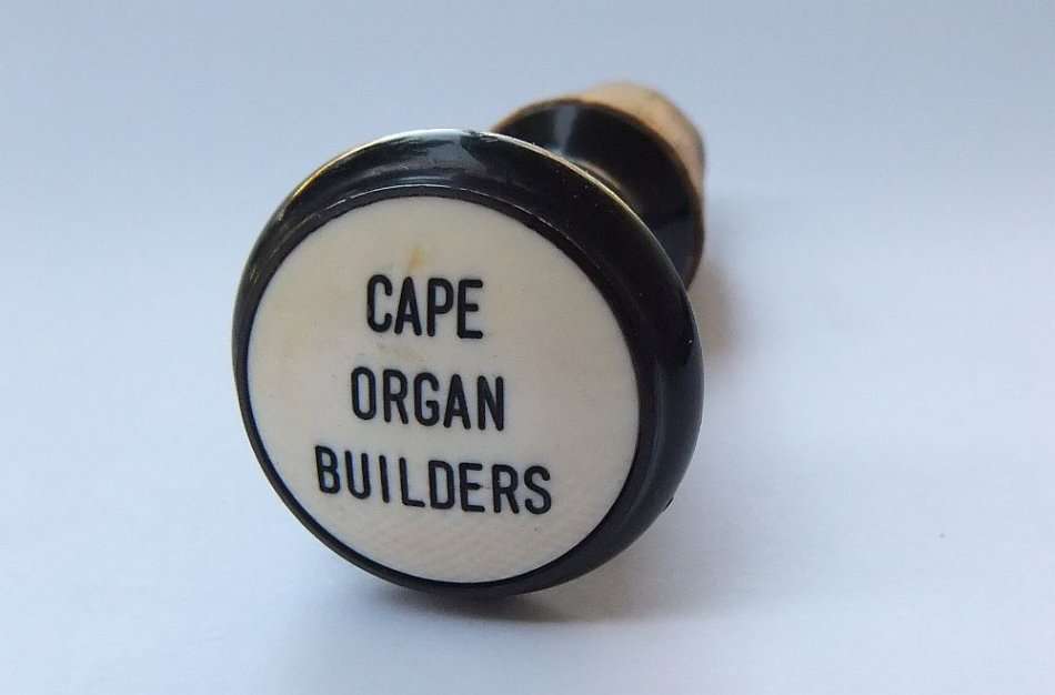 A RARE VINTAGE "CAPE ORGAN BUILDERS" ADVERTISING CORK STOP
