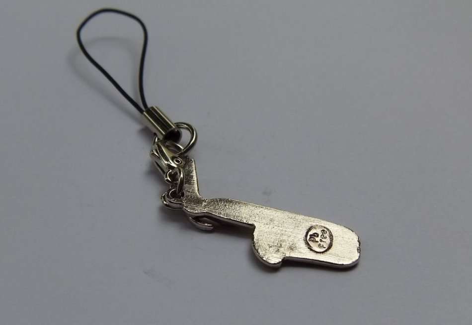 A SAXOPHONE THEMED CELLPHONE ACCESSORY
