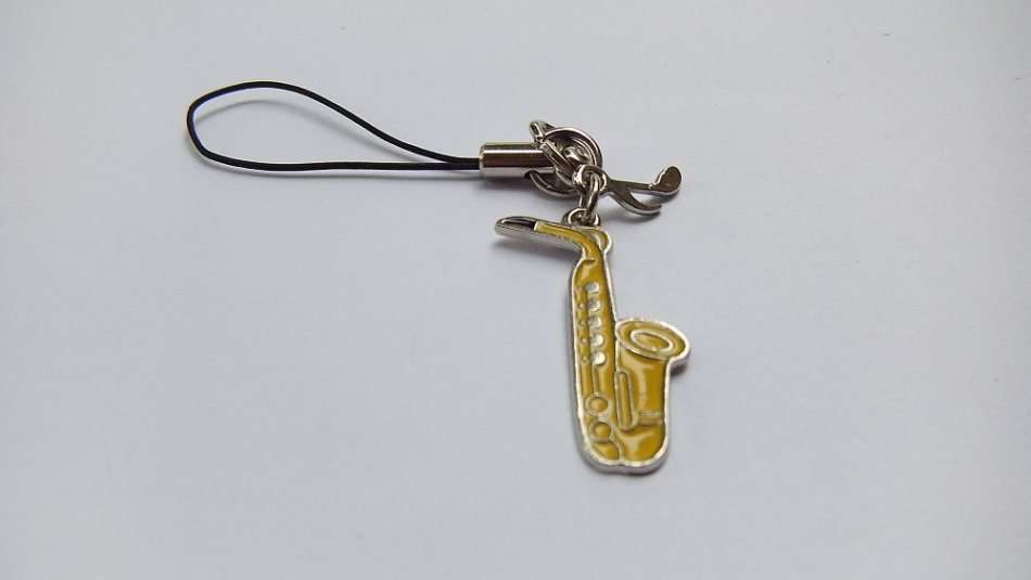 A SAXOPHONE THEMED CELLPHONE ACCESSORY