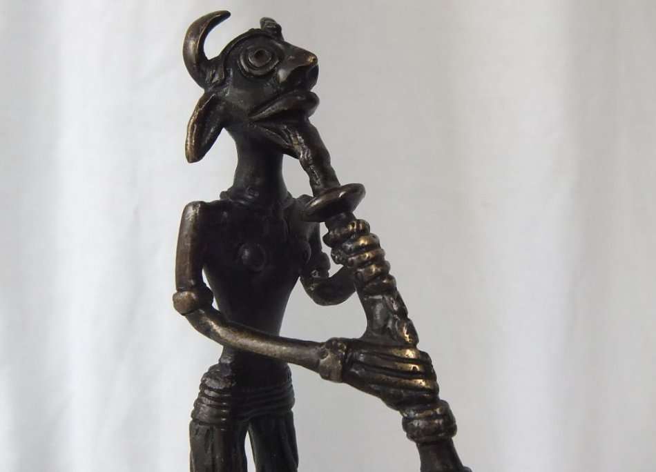 WOW !! AN OLD AND HEAVY BRONZE MYTHICAL MUSICIAN FIGURE ON A GREEN ALABASTER BASE !! MUST SEE !!