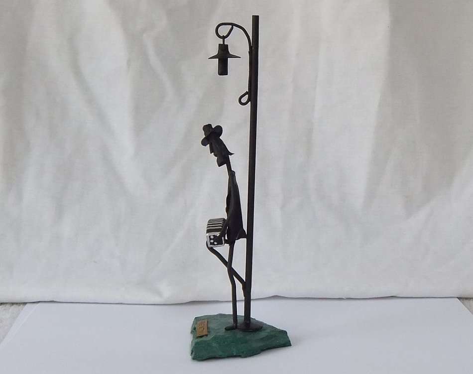 AN AWESOME VINTAGE METAL AND "ROCK" STATUE OF A MUSICIAN UNDER A LAMP POST !! MADE IN ARGENTINA !!