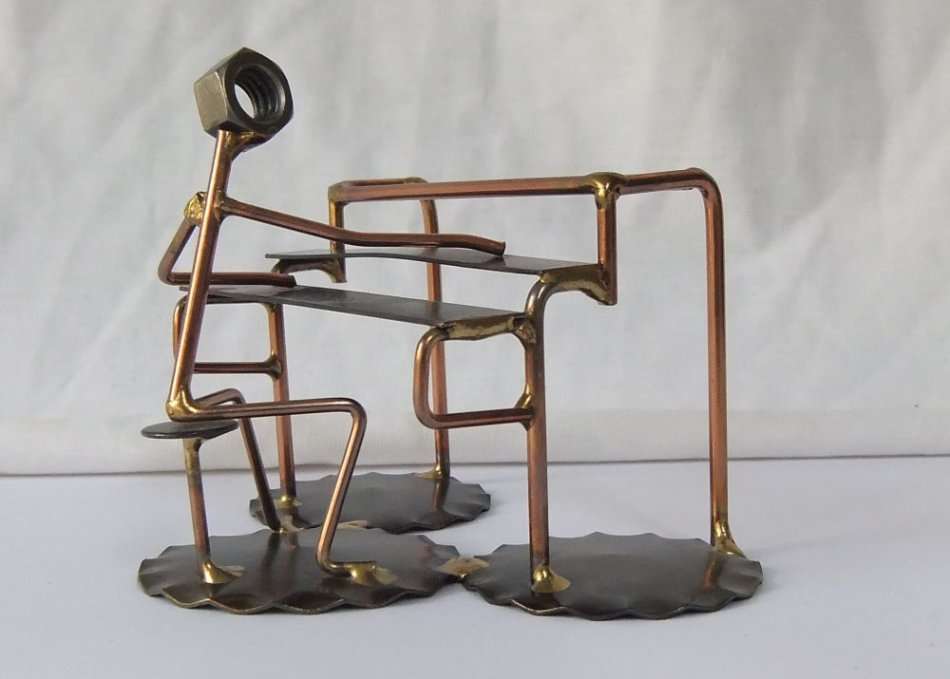 A METAL SCULPTURE OF AN ORGAN PLAYER BY ROCK CREEK METAL CRAFT U.S.A !! HANDCRAFTED !!