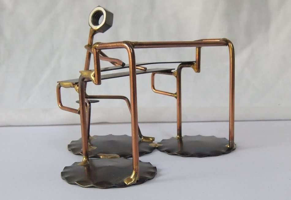 A METAL SCULPTURE OF AN ORGAN PLAYER BY ROCK CREEK METAL CRAFT U.S.A !! HANDCRAFTED !!