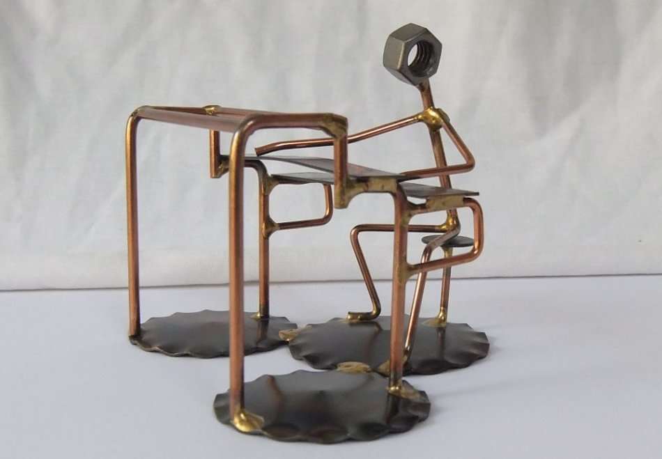 A METAL SCULPTURE OF AN ORGAN PLAYER BY ROCK CREEK METAL CRAFT U.S.A !! HANDCRAFTED !!