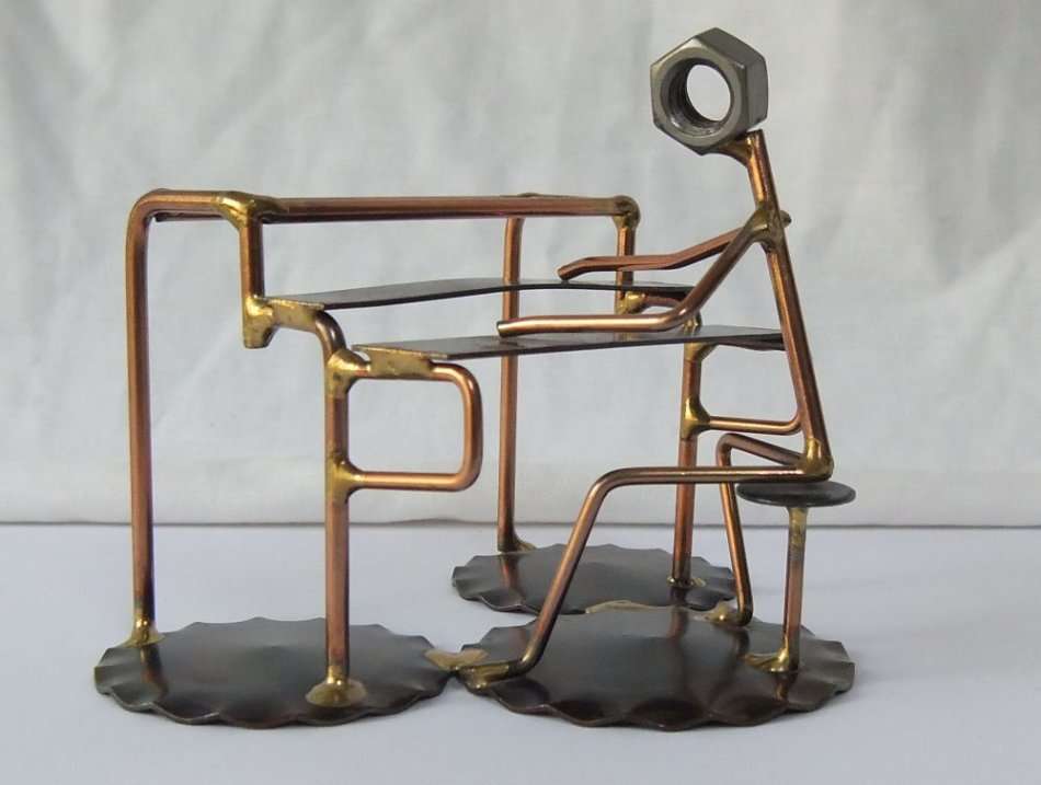 A METAL SCULPTURE OF AN ORGAN PLAYER BY ROCK CREEK METAL CRAFT U.S.A !! HANDCRAFTED !!