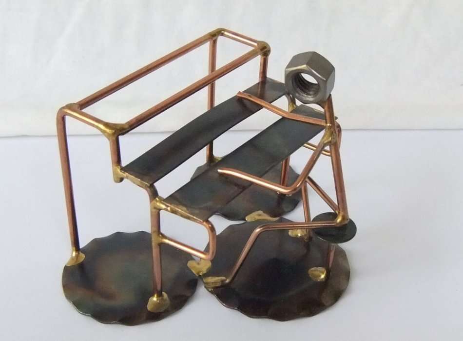 A METAL SCULPTURE OF AN ORGAN PLAYER BY ROCK CREEK METAL CRAFT U.S.A !! HANDCRAFTED !!