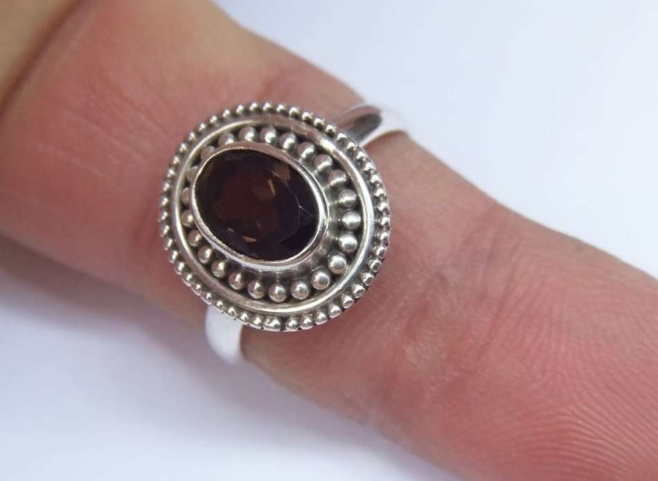 A STYLISH SOLID STERLING SILVER RING SET WITH A TOPAZ COLORED STONE !! FULLY STAMPED AND TESTED !!