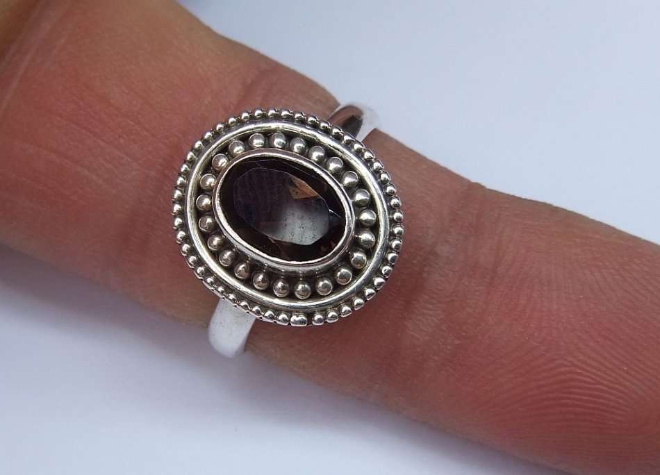 A STYLISH SOLID STERLING SILVER RING SET WITH A TOPAZ COLORED STONE !! FULLY STAMPED AND TESTED !!