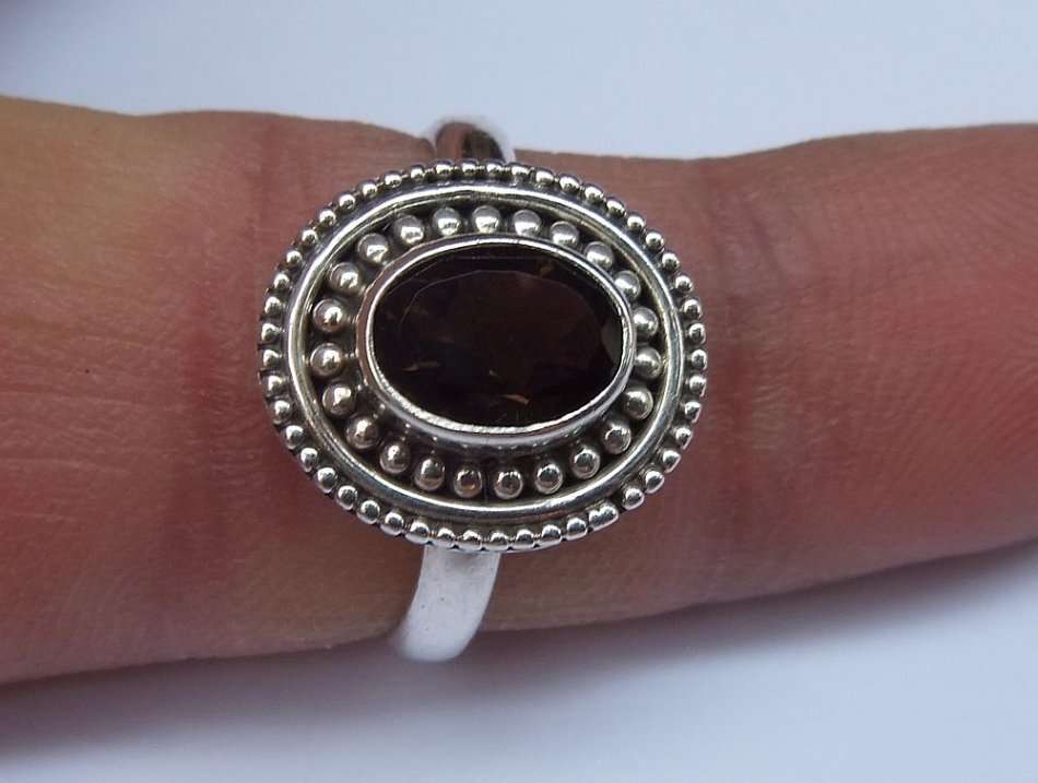 A STYLISH SOLID STERLING SILVER RING SET WITH A TOPAZ COLORED STONE !! FULLY STAMPED AND TESTED !!