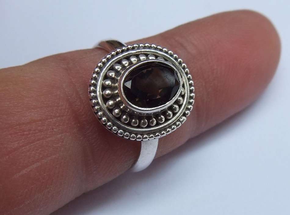 A STYLISH SOLID STERLING SILVER RING SET WITH A TOPAZ COLORED STONE !! FULLY STAMPED AND TESTED !!