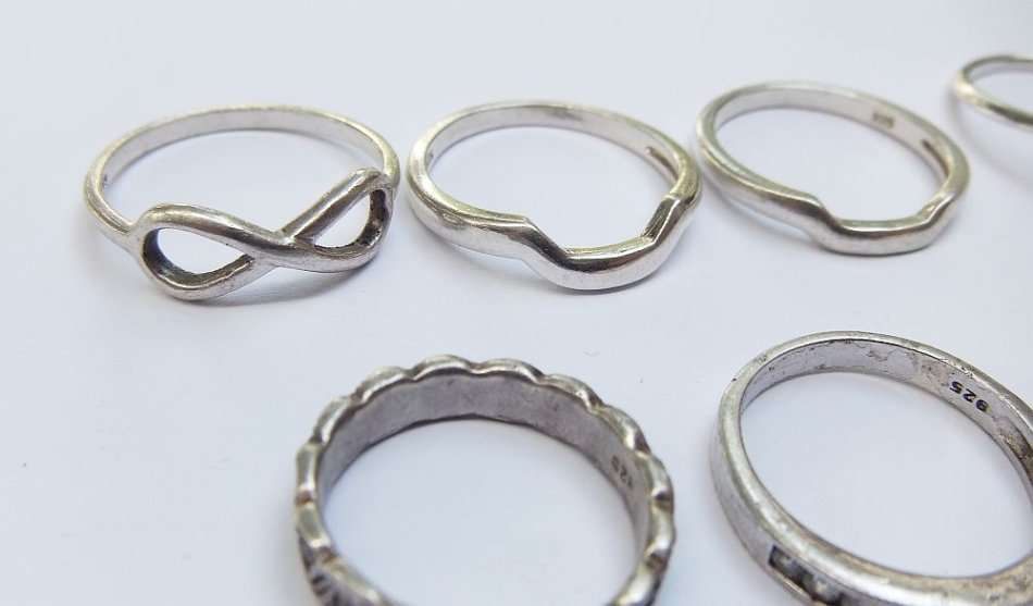 OH BOY !! WHAT A TREAT !! NINE SOLID STERLING SILVER RINGS FOR YOUR COLLECTION !! BID FOR THE LOT !!