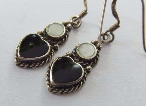 A STYLISH PAIR OF SOLID STERLING SILVER EARRINGS WITH BLACK HEART INSETS AND MOTHER OF PEARL !! WOW