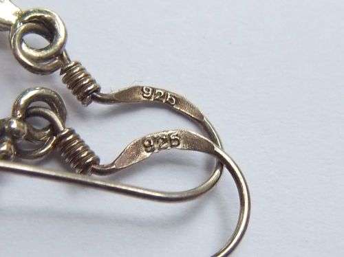 A STYLISH PAIR OF SOLID STERLING SILVER EARRINGS WITH BLACK HEART INSETS AND MOTHER OF PEARL !! WOW