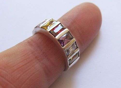 A VERY STYLISH QUALITY SOLID STERLING SILVER RING SET WITH GORGEOUS MULTI COLORED FACETED STONES !!