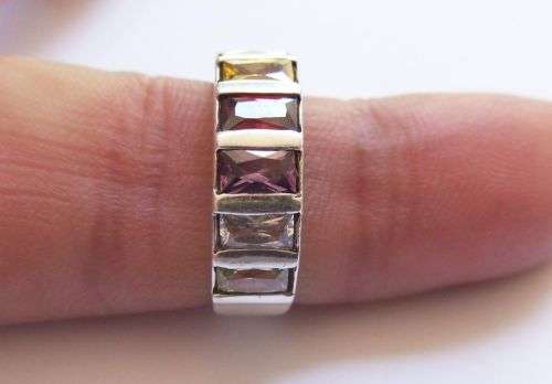 A VERY STYLISH QUALITY SOLID STERLING SILVER RING SET WITH GORGEOUS MULTI COLORED FACETED STONES !!