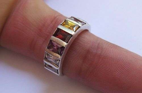 A VERY STYLISH QUALITY SOLID STERLING SILVER RING SET WITH GORGEOUS MULTI COLORED FACETED STONES !!