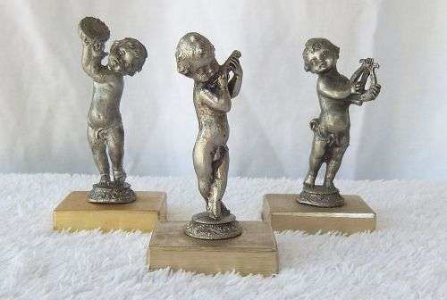 LOOK !! AN ADORABLE SET OF THREE PEWTER TYPE METAL CHERUBS ON METAL PLINTHS !! MUSICAL VIBES !!
