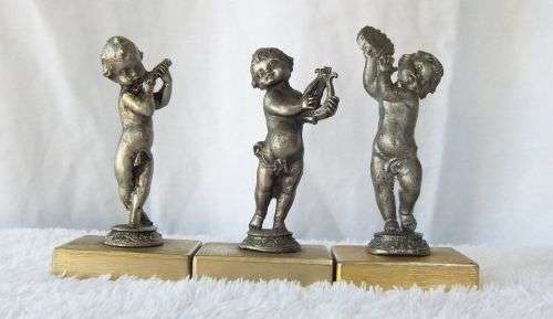 LOOK !! AN ADORABLE SET OF THREE PEWTER TYPE METAL CHERUBS ON METAL PLINTHS !! MUSICAL VIBES !!