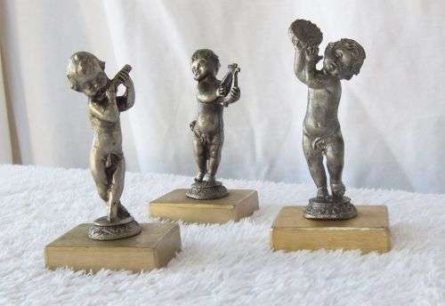 LOOK !! AN ADORABLE SET OF THREE PEWTER TYPE METAL CHERUBS ON METAL PLINTHS !! MUSICAL VIBES !!