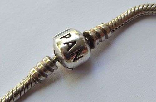 WOW ! OVER R3000 VALUE !! A GENUINE PANDORA SOLID STERLING SILVER CHARM BRACELET WITH FIVE CHARMS !!