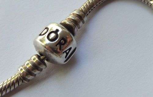 WOW ! OVER R3000 VALUE !! A GENUINE PANDORA SOLID STERLING SILVER CHARM BRACELET WITH FIVE CHARMS !!