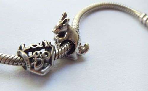 WOW ! OVER R3000 VALUE !! A GENUINE PANDORA SOLID STERLING SILVER CHARM BRACELET WITH FIVE CHARMS !!