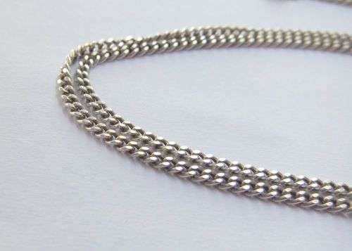 A COOL SOLID STERLING SILVER AFRICA PENDANT SET WITH A FACETED STONE PLUS A STERLING SILVER NECKLACE