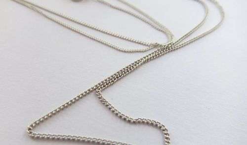 GENUINE SHELL & A WHALE TAIL !! TWO STERLING SILVER NECKLACES AND TWO STERLING SILVER PENDANTS !!