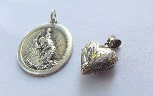 FOR HIM AND HER !! A SOLID STERLING SILVER ST CHRISTOPHER AND A HOLLOW HEART PENDANT !! TAKE BOTH !!