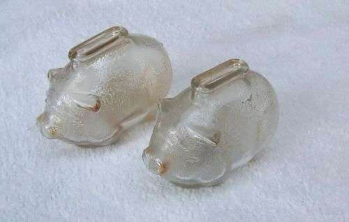 TAKE TWO !! A CUTE PAIR OF VINTAGE GLASS PIG FORM MONEY BANKS IN GOOD CONDITION
