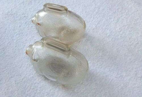 TAKE TWO !! A CUTE PAIR OF VINTAGE GLASS PIG FORM MONEY BANKS IN GOOD CONDITION
