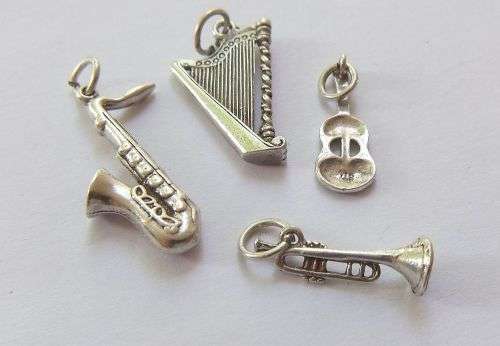 A DELIGHTFUL LOT OF 4 SOLID STERLING SILVER MUSICAL INSTRUMENT CHARMS IN EXCELLENT CONDITION !! WOW