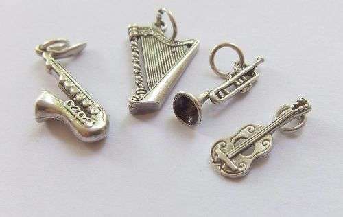 A DELIGHTFUL LOT OF 4 SOLID STERLING SILVER MUSICAL INSTRUMENT CHARMS IN EXCELLENT CONDITION !! WOW