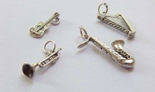 A DELIGHTFUL LOT OF 4 SOLID STERLING SILVER MUSICAL INSTRUMENT CHARMS IN EXCELLENT CONDITION !! WOW