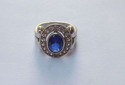 A GORGEOUS SOLID STERLING SILVER RING SET WITH A FACETED BLUE STONE AND CLEAR STONES !! MUST SEE !!