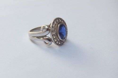 A GORGEOUS SOLID STERLING SILVER RING SET WITH A FACETED BLUE STONE AND CLEAR STONES !! MUST SEE !!