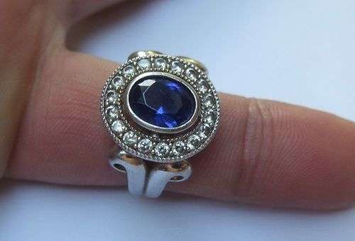 A GORGEOUS SOLID STERLING SILVER RING SET WITH A FACETED BLUE STONE AND CLEAR STONES !! MUST SEE !!