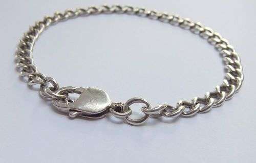 A STRONG VINTAGE  SOLID STERLING SILVER STARTER CHARM BRACELET WITH OVERSIZED CLASP !! WOW !!