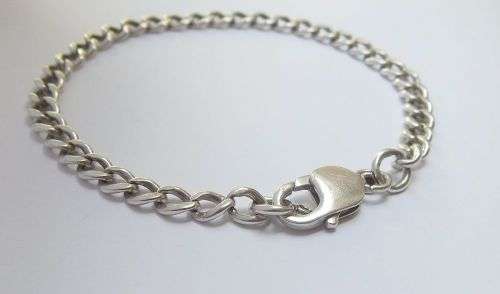 A STRONG VINTAGE  SOLID STERLING SILVER STARTER CHARM BRACELET WITH OVERSIZED CLASP !! WOW !!