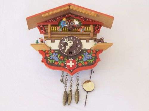 AN ADORABLE VINTAGE SWISS WALL CLOCK WITH LOADS OF CUTE DETAIL !! NO KEY TO TEST ... NEEDS TLC ??