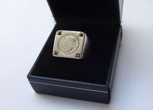 A COOL VINTAGE SOLID STERLING SILVER RING WITH `COIN` FEATURE AND FOUR FACETED RED STONES !! WOW !!