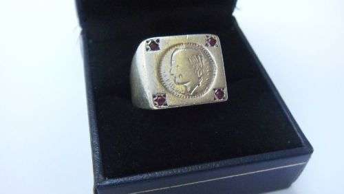 A COOL VINTAGE SOLID STERLING SILVER RING WITH `COIN` FEATURE AND FOUR FACETED RED STONES !! WOW !!