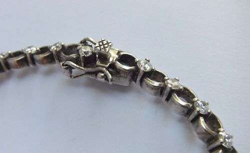 A CLASSY VINTAGE LOOK SOLID STERLING SILVER BRACELET WITH SAFETY CLASP AND FACETED STONES !! LOOK !!