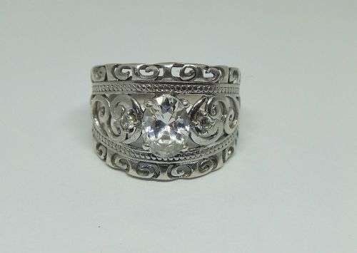 A SUPERB SOLID STERLING SILVER RING WITH UNIQUE DESIGN SET WITH FACETED CZ STONES !! FULLY TESTED !!
