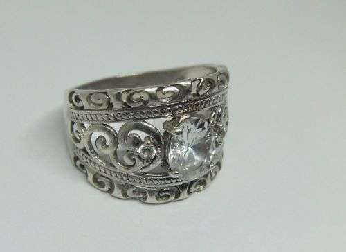 A SUPERB SOLID STERLING SILVER RING WITH UNIQUE DESIGN SET WITH FACETED CZ STONES !! FULLY TESTED !!